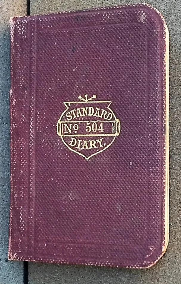 Small cloth-bound pocket diary stamped Standard Diary No. 504 in gold